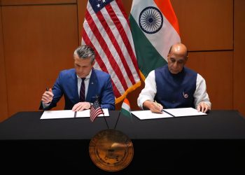 Defence Minister Rajnath Singh and U.S. Secretary of War Pete Hegseth signing a new 10-year defence framework agreement in Malaysia. | Photo Credit: The Hindu 