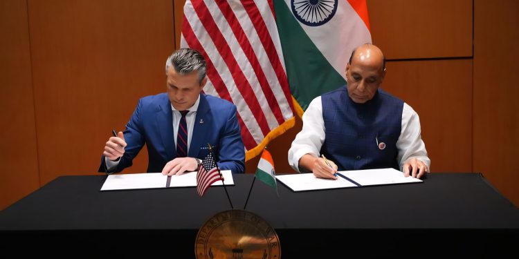Defence Minister Rajnath Singh and U.S. Secretary of War Pete Hegseth signing a new 10-year defence framework agreement in Malaysia. | Photo Credit: The Hindu